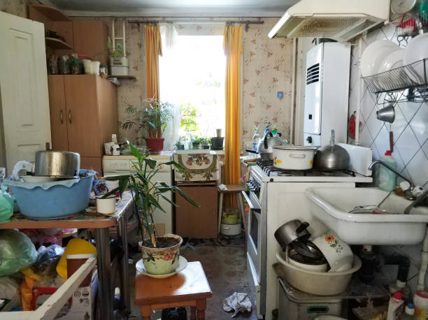 mess and dump. An old room with lots of things. Devastation. Very small housing.
